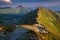 Summer hiking in the mountains with massive rocks, dramatic skies and majestic mountains.