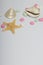 Summer holiday accessories. Colored pebbles, seashells and starfish on a white background