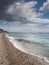 Summer holiday background, Sicily coast, Clear blue wave of the Mediterranean sea, Selective focus. Vertical image