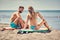 Summer holiday road trip vacation- surfer couple at the beach ge
