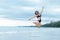 Summer holiday vacation concept. Traveler woman lifestyle in bikini jumping and enjoying relaxing