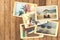 Summer holiday vacation photo album with retro polaroid instant photos on wooden table