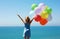 summer holidays, celebration, family, children and people concept - happy girl with colorful balloons