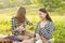 Summer holidays and vacations. Two young girls on a picnic eating, drinking lemonade