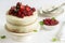 Summer home biscuit cake with curd cream, decorated with fresh berries of strawberries, raspberries and currants.