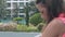 Summer hotel resort with blurred tanned lady on foreground