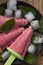 Summer icecream. Homemade berry popsicles on a rustic wood background. Fresh strawberry lolly icecream. Greate treat for kids