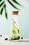 Summer infused water with cucumber, blackberry and rosemary on blue sky background, summer refreshment concept