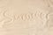 Summer inscription on light beach sand