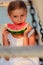 Summer joy, lovely girl eating fresh watermelon on the beach