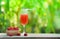 Summer juice glass raspberry cocktail and fresh raspberries fruit on wooden bowl