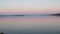 Summer lake. Panoramic view of old fishing boats. View of sunset