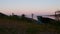 Summer lake. Panoramic view of old fishing boats. View of sunset