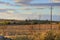 Summer landscape. Alta Murgia National Park:harvested fields at sunset with rows of electric poles.Italy Apulia.