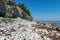 Summer landscape with dolomite rocks by the sea, beautiful view of wild romantic coastal cliff landscape at the Baltic Sea at