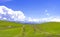 Summer landscape with green hills and dirt roads. Plateau Assy, Kazakhstan