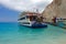 Summer landscape. Ionian Sea. Cruise ship on Navagio beach - Zakynthos Island, landmark attraction in Greece. Seascape