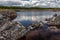 Summer landscape of lake in abandoned former marble stone mine