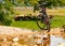 Summer landscape with mountain bike on dirty road