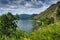 Summer landscape with mountains on lake Baikal. Circum-Baikal Railway, Siberia. Coastline of most deep clear lake in the