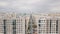 Summer landscape of a new city district on a summer sunny day. Video. Aerial view of newly built high rise residential