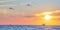Summer landscape. Ocean panorama and Golden hour. Sunset and Floating yacht on water. Burning sky. Small sea waves