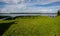 Summer landscape overgrown bank of the russian volga river on a sunny day