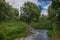 Summer landscape with river near Norcia, Italy