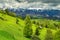 Summer landscape with snowy mountains near Brasov, Transylvania, Romania, Europe