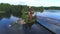 Summer landscape of the Vuoksa river with a wooden Church of St. Andrew. Russia