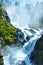 Summer Latefossen waterfall on mountain slope (Nor