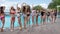 Summer life of youth on weekend, smiling girlfriends in swimsuit have fun near poolside, crowd of woman on resort,