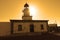 Summer: a lighthouse with sunset light of cape of the Crosses in Spain