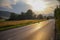 Summer meadow landscape. Sunshine with a road