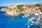 Summer mediterranean cityscape - view of the the Fort Lovrijenac and harbor with a group of kayaks, the Old Town of Dubrovnik