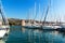 Summer morning in the harbor. Yachts parking in harbor, Harbor in Trogir, Croatia. Sailboats reflected in water. Boat rental