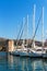 Summer morning in the harbor. Yachts parking in harbor, Harbor in Trogir, Croatia. Sailboats reflected in water. UNESCO world