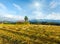 Summer mountain evening country view with mown field