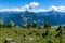 Summer mountain landscape with blue cloudy sky and hang glider. Austria, Tyrol, Zillertal Valley