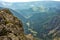 Summer in the mountains. Beautiful panorama for a postcard or calendar. View of the verdant slopes and hills and valleys. Mountain