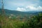 Summer mountains green grass and blue sky landscape, view from mountain peak at Broga Hill, Malaysia