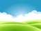Summer nature background, a landscape with green hills and meadows, blue sky and clouds.