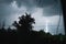 Summer night thunderstorm with powerful lightning in the village