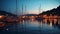 summer night in Yacht harbor blurred sea and city light reflection people silhouette relax in cafe on promenade