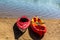 Summer in Omaha, Kayaks on the beach by the waters edge at Ed Zorinsky lake park, Omaha, Nebraska, USA