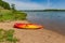 Summer in Omaha, Kayaks on the beach by the waters edge at Ed Zorinsky lake park, Omaha, Nebraska, USA