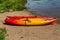 Summer in Omaha, Kayaks on the beach by the waters edge at Ed Zorinsky lake park, Omaha, Nebraska, USA