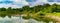 Summer in Omaha, Panorama Shoreline reflections in the lake at Ed Zorinsky Lake Park Omaha NE