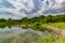 Summer in Omaha, Panorama Shoreline and sky reflections in the lake at Ed Zorinsky Lake Park Omaha NE