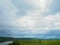 Summer panorama before a thunder-storm field a river and a forest in the distance, in the Russian